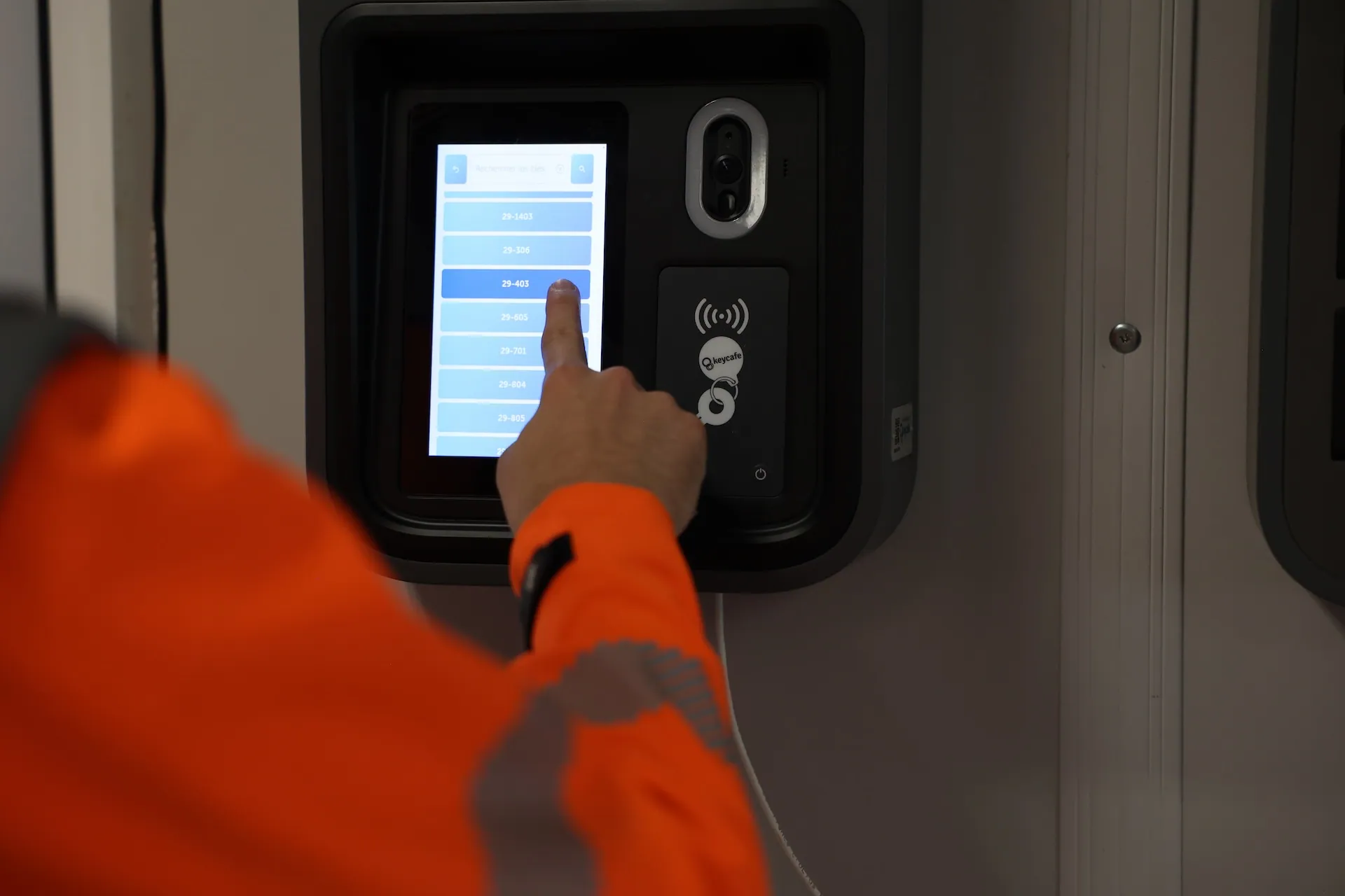 Close up of a construction working selecting a key on a SmartBox screen