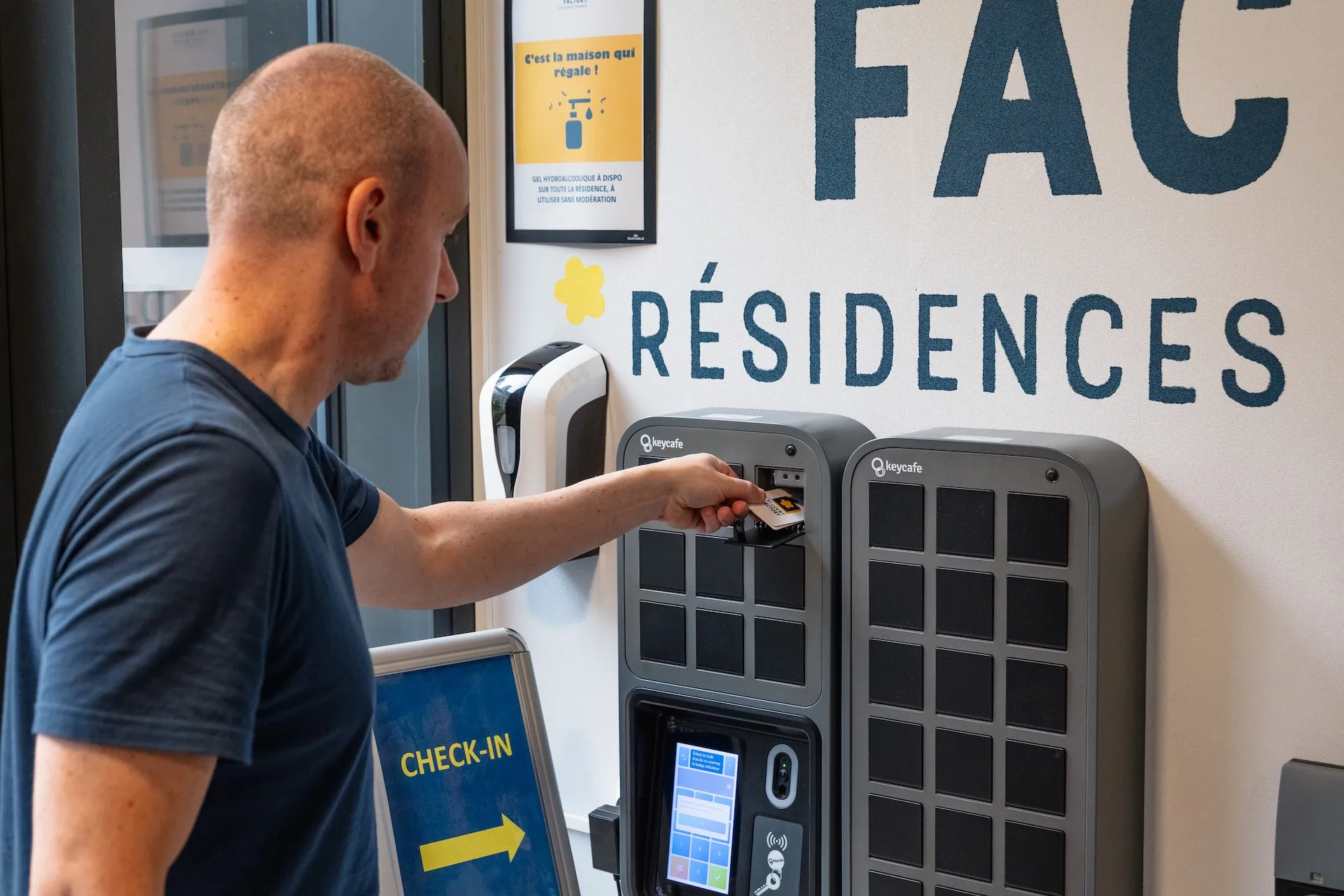 Marc Guyon placing a keycard inside a SmartBox bin