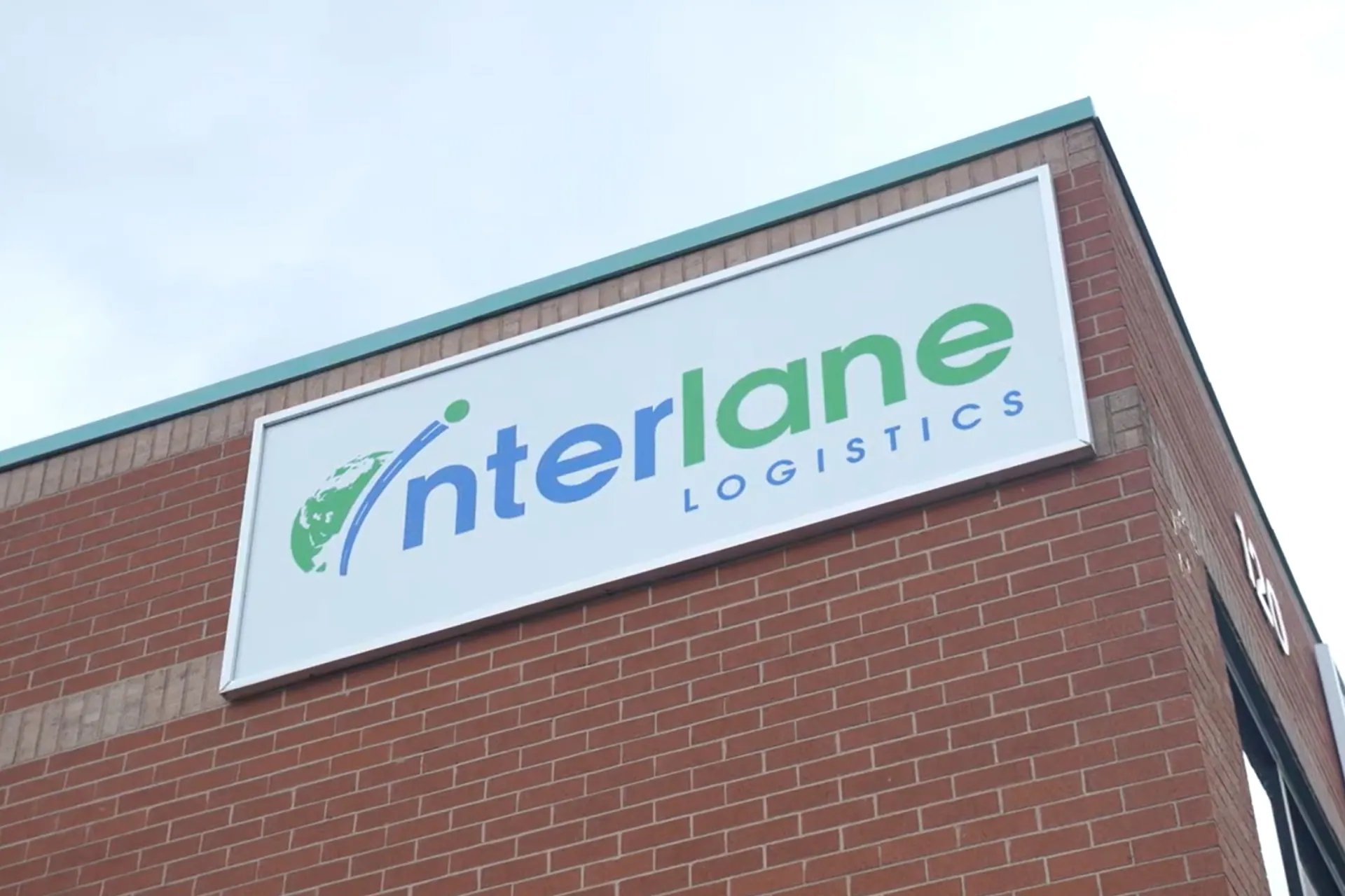 The Interlane Logistics logo on a building exterior