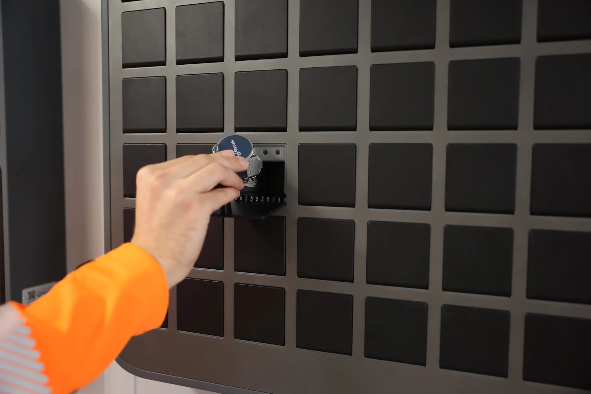 Construction worker placing a key into a SmartBox bin