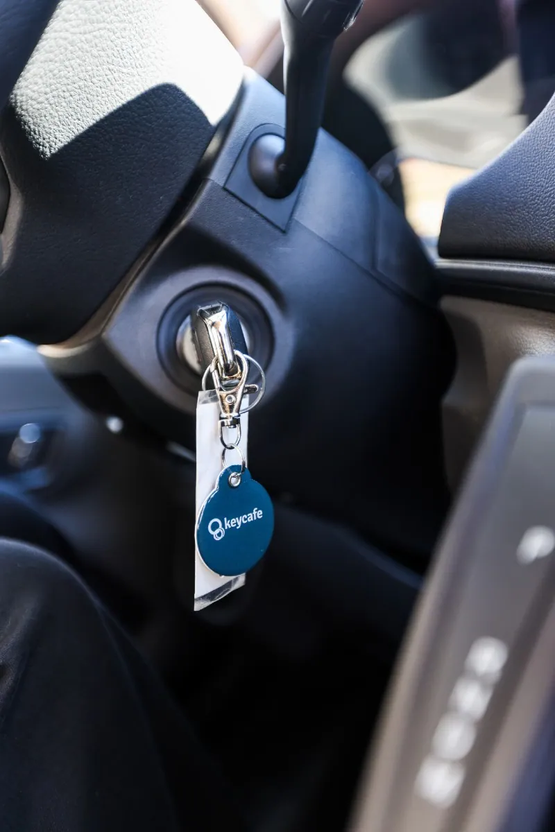 Close up of keys with Keycafe fob attached in the ignition of a vehicle