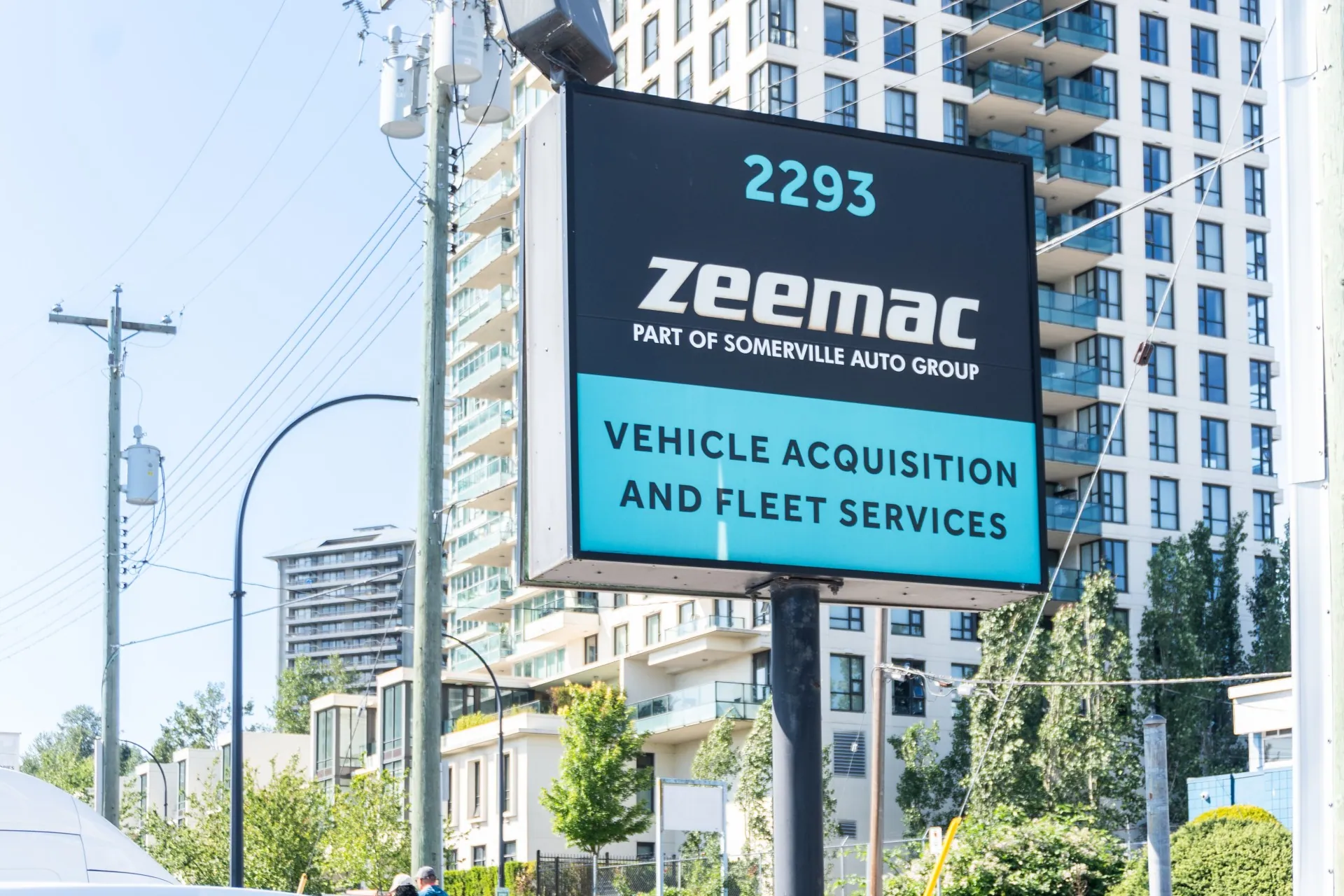 Outdoor Zeemac and Somerville Auto sign outside their office