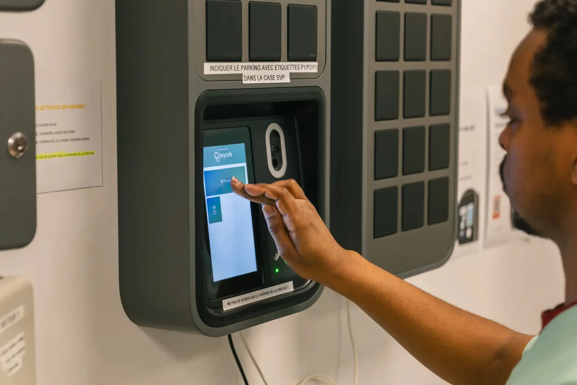 Man tapping a SmarBox screen