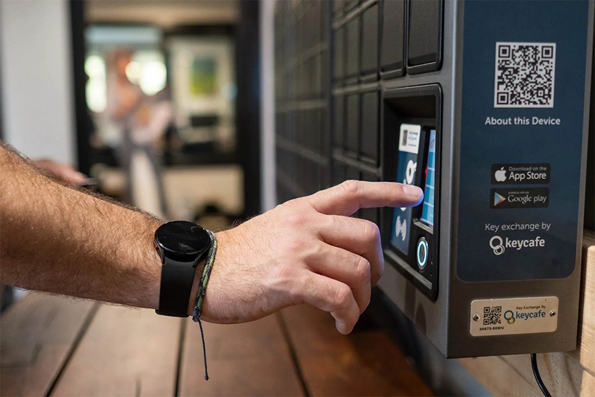 Digital Asset Manager Tyler Burley tapping the SmartBox screen