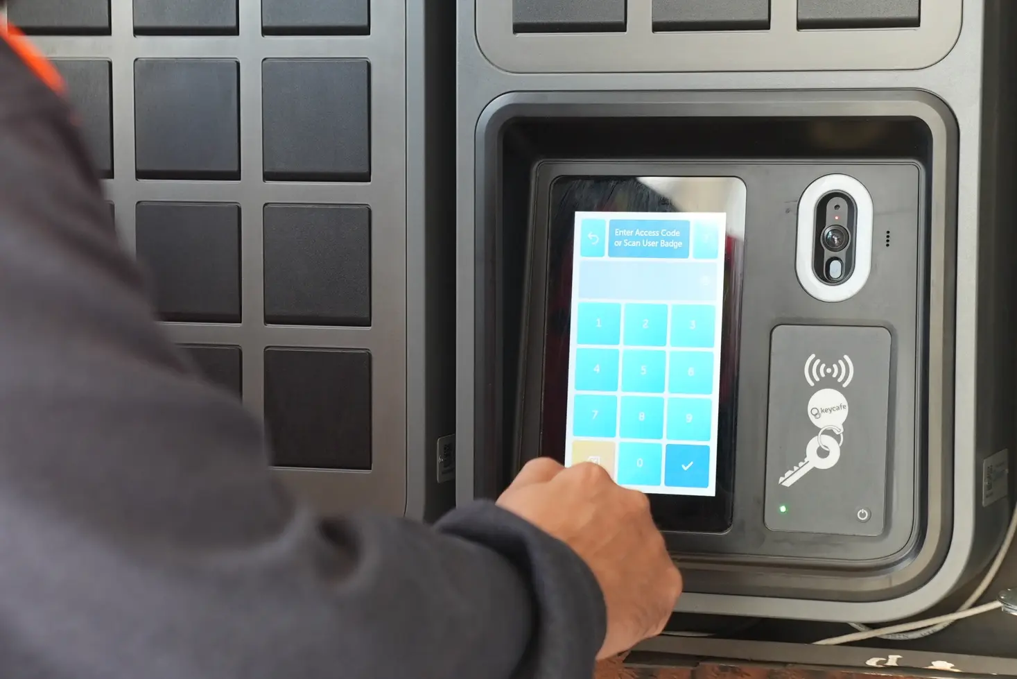 Close up of someone using the Keycafe SmartBox screen